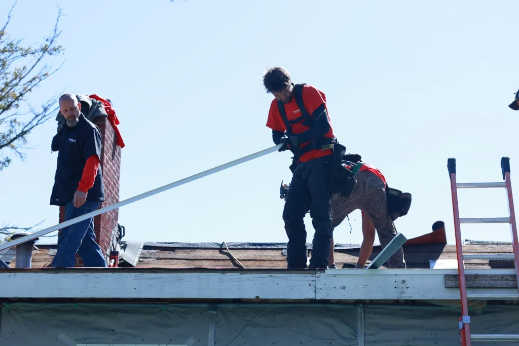 Shane David Roofing crew working on a roof replacement in Northern Michigan